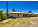 Charming home featuring a well-manicured front yard and a pathway to the entrance at 3936 E Oak St, Phoenix, AZ 85006