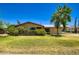 Charming home featuring a well-maintained front yard and mature trees at 3936 E Oak St, Phoenix, AZ 85006