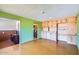 Bright living room featuring built-in cabinets and a view into the kitchen at 3936 E Oak St, Phoenix, AZ 85006