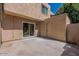 An empty back patio with a sliding glass door for accessing the home's interior at 4268 N 68Th Ave, Phoenix, AZ 85033