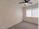 Bedroom featuring gray carpet, white walls, and a window with white blinds at 4268 N 68Th Ave, Phoenix, AZ 85033