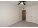 Bedroom featuring gray carpet and white walls leading into a closet or storage room at 4268 N 68Th Ave, Phoenix, AZ 85033