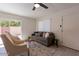 Bright living room featuring modern decor, stylish furnishings, and sliding glass doors with access to the backyard at 4268 N 68Th Ave, Phoenix, AZ 85033