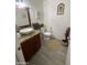 Well-decorated half bathroom with granite counters, decorative mirror, and a modern vessel sink at 4729 W Eva St, Glendale, AZ 85302