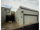A well-maintained two-story house with an attached garage featuring desert landscaping and block wall construction at 4729 W Eva St, Glendale, AZ 85302