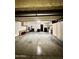 Spacious garage with epoxy flooring, ample storage cabinets, and laundry area at 4729 W Eva St, Glendale, AZ 85302