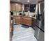 Kitchen with stainless steel appliances, custom cabinetry, and tile flooring at 4729 W Eva St, Glendale, AZ 85302