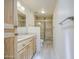Updated bathroom with modern vanity, and a glass-enclosed shower with stylish tile work at 5335 N 78Th St, Scottsdale, AZ 85250