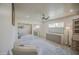 Serene bedroom with plush carpeting, mirrored closets, and abundant natural light from the large window at 5335 N 78Th St, Scottsdale, AZ 85250