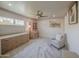 Inviting bedroom with a cozy chair, dresser, and stylish decor providing a comfortable retreat at 5335 N 78Th St, Scottsdale, AZ 85250