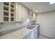 Bright kitchen with white cabinetry, granite counters, subway tile backsplash and stainless steel appliances at 5335 N 78Th St, Scottsdale, AZ 85250