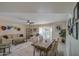 Open-concept living and dining area featuring stylish furniture, wood floors, and ample space for entertaining guests at 5335 N 78Th St, Scottsdale, AZ 85250