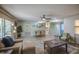 Spacious living and dining area with wood floors, comfortable seating, and ample natural light, ideal for gatherings at 5335 N 78Th St, Scottsdale, AZ 85250