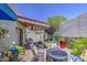 Cozy outdoor patio with comfortable seating, potted plants, and covered area for relaxation and entertainment at 5335 N 78Th St, Scottsdale, AZ 85250