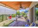 Charming covered patio with stylish furniture, lush greenery, and pavers, ideal for outdoor living at 5335 N 78Th St, Scottsdale, AZ 85250