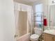 Full bathroom featuring a bathtub, a shower with curtain, and a modern toilet at 5735 E Mcdowell Rd # 436, Mesa, AZ 85215