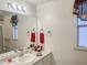 Bright bathroom featuring a large mirror, decorative towels, and a well-lit vanity at 5735 E Mcdowell Rd # 436, Mesa, AZ 85215