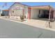 Charming single-level home featuring an open carport, well-maintained landscaping, and an inviting curb appeal at 5735 E Mcdowell Rd # 436, Mesa, AZ 85215