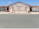Charming single-story home featuring a covered carport, landscaped front yard, and decorative exterior details at 5735 E Mcdowell Rd # 436, Mesa, AZ 85215