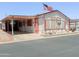 Charming single-level home featuring an open carport, well-maintained landscaping, and an inviting curb appeal at 5735 E Mcdowell Rd # 436, Mesa, AZ 85215