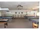 Large game room featuring pool tables, ping pong, and comfortable seating at 5735 E Mcdowell Rd # 436, Mesa, AZ 85215