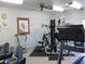Well-equipped fitness center with exercise machines, weights, and ceiling fan for comfortable workouts at 5735 E Mcdowell Rd # 436, Mesa, AZ 85215