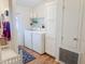 Well-organized laundry room featuring a washer, dryer, and ample storage space at 5735 E Mcdowell Rd # 436, Mesa, AZ 85215
