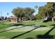 Scenic putting green with mature trees and gazebo, perfect for relaxation and outdoor activities at 5735 E Mcdowell Rd # 436, Mesa, AZ 85215