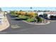 Neighborhood street featuring well-maintained landscaping and various homes with driveway parking at 5735 E Mcdowell Rd # 436, Mesa, AZ 85215
