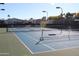 Well-maintained tennis court with new net, surrounded by lush greenery and community residences at 5735 E Mcdowell Rd # 436, Mesa, AZ 85215