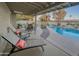 Relaxing back patio with a lounge chairs, covered patio, table set, and an inviting pool for outdoor enjoyment at 6639 E Pershing Ave, Scottsdale, AZ 85254