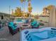 Relaxing backyard with a pool, spa, fire pit, and comfortable seating, perfect for outdoor enjoyment at 6639 E Pershing Ave, Scottsdale, AZ 85254