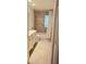 Bright bathroom features a tub with tile surround and neutral tile flooring at 6639 E Pershing Ave, Scottsdale, AZ 85254