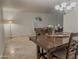 Traditional dining room features a dark wood table, four chairs, chandelier, and tile floors at 6639 E Pershing Ave, Scottsdale, AZ 85254
