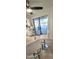 Bright kitchen breakfast nook that overlooks the pool area with a ceiling fan at 6639 E Pershing Ave, Scottsdale, AZ 85254