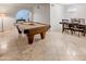 Spacious living room with a billiards table and a separate dining area at 6639 E Pershing Ave, Scottsdale, AZ 85254