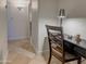 Office nook features a dark wood desk, chair, task lighting, and tile floors at 6639 E Pershing Ave, Scottsdale, AZ 85254