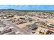 Residential aerial view of a neighborhood showcasing a home with a brick driveway at 8226 W Swansea Dr, Arizona City, AZ 85123