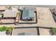 Residential aerial view showcasing backyard and roof features surrounded by fencing at 8226 W Swansea Dr, Arizona City, AZ 85123