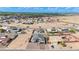 Neighborhood aerial view of a single-story house with a brick driveway in a desert community at 8226 W Swansea Dr, Arizona City, AZ 85123