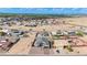 Expansive aerial view of a residential neighborhood featuring desert landscaping and mountain views at 8226 W Swansea Dr, Arizona City, AZ 85123