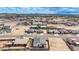 An aerial view showcasing a sprawling residential area with neat rows of houses against a mountainous horizon at 8226 W Swansea Dr, Arizona City, AZ 85123