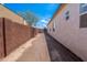 Backyard featuring block wall fencing and direct access to outdoor gate at 8226 W Swansea Dr, Arizona City, AZ 85123