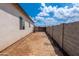 Backyard with block wall fencing and AC unit at 8226 W Swansea Dr, Arizona City, AZ 85123
