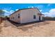 Spacious backyard featuring block wall fencing and direct access to outdoor gate at 8226 W Swansea Dr, Arizona City, AZ 85123