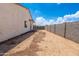 A view of the home's backyard featuring ample space and secure fencing at 8226 W Swansea Dr, Arizona City, AZ 85123