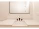 Bathroom with white vanity, modern sink, matte black faucet and large mirror at 8226 W Swansea Dr, Arizona City, AZ 85123