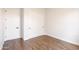 Bedroom with wood-look tile flooring and white doors and trim at 8226 W Swansea Dr, Arizona City, AZ 85123