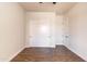 Bedroom with wood-look tile flooring, ceiling fan, and white doors at 8226 W Swansea Dr, Arizona City, AZ 85123