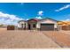 Attractive single-story home with a stone accent wall, brick driveway and low maintenance desert landscaping at 8226 W Swansea Dr, Arizona City, AZ 85123